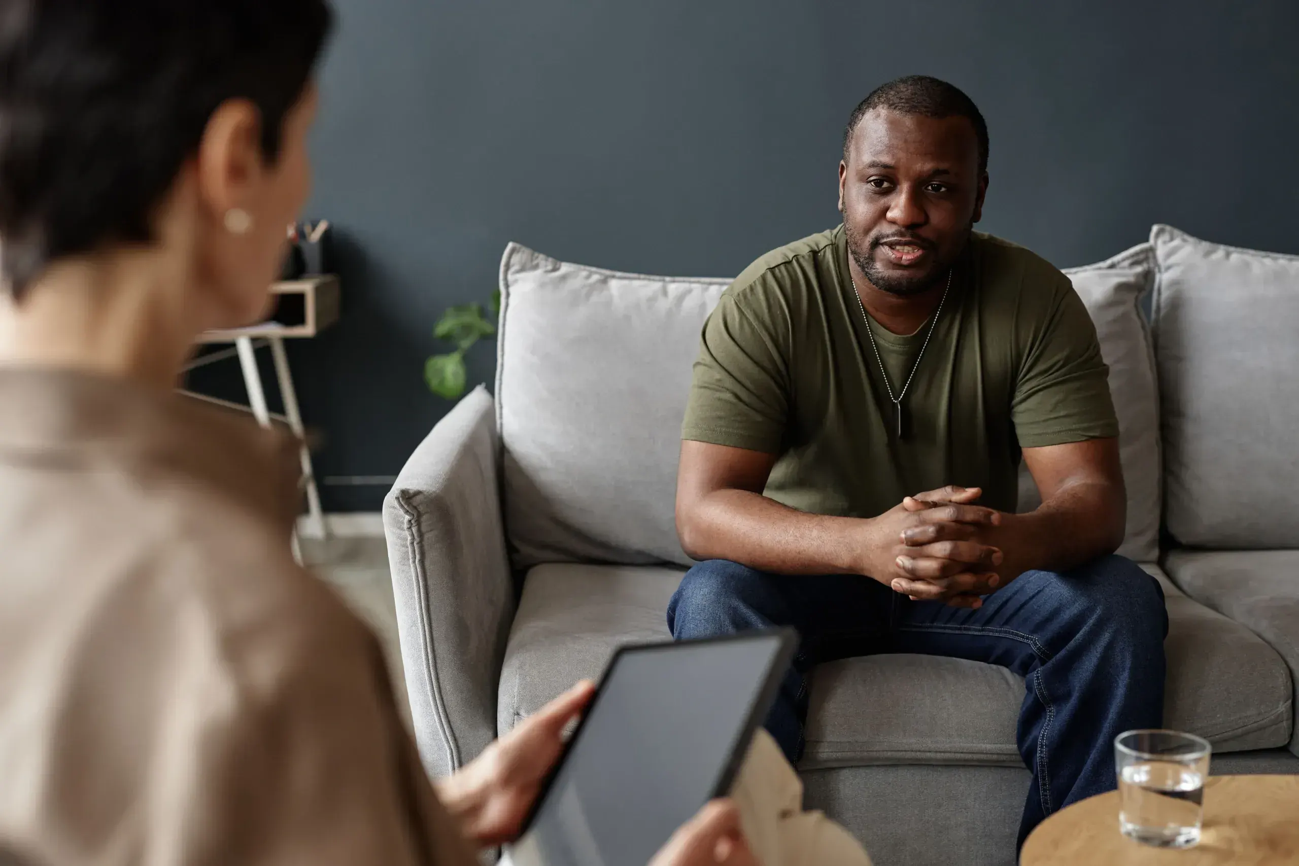 Adult patient meeting compassionately with provider for PTSD care at Riverstone Wellness Easley